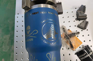 Fiber laser marking machine remove the paint from the metal tube with chuck rotary